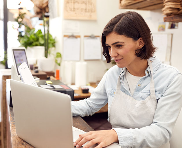 A franchise owner running through chargeback reports built using American PaySave POS systems