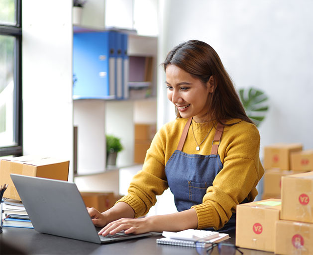 A shop owner utilizing back office tools from American PaySave's POS systems