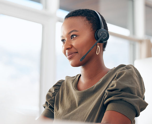 A woman providing customer support thanks to the help of American PaySave's POS systems