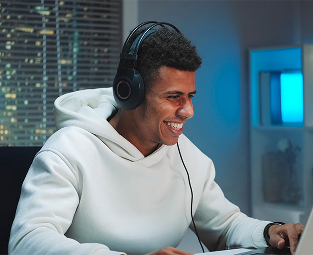 A gamer enjoying multi currency conversion services from American PaySave