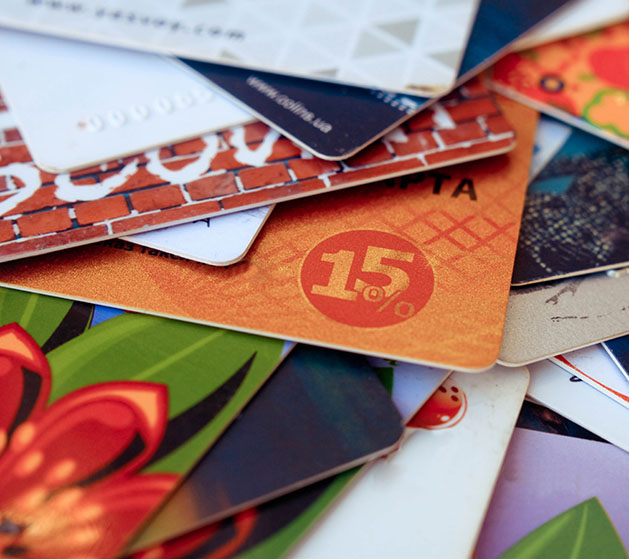 A stacked of customized gift cards made using American PaySave's POS services