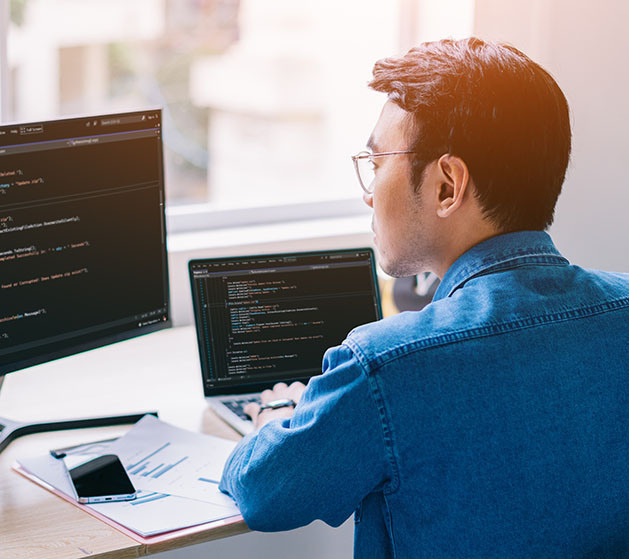 A developer working on code for his online store using American PaySave POS software