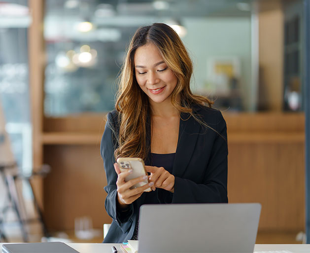 A woman enjoying multi-currency conversion services on her dating app thanks to American PaySave's POS services