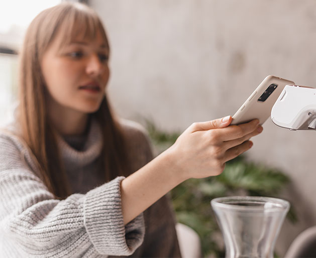 A customer using a American PaySave Payanywhere mobile terminal