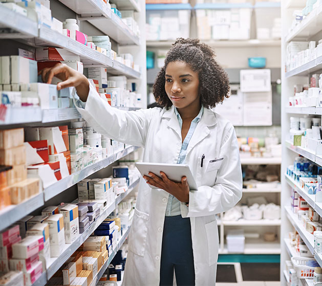 A pharmacist taking stock using American PaySave's inventory management systems 
