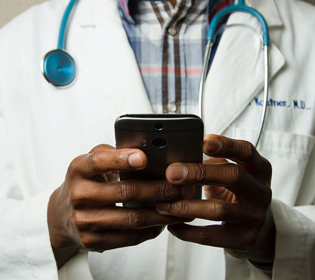 A doctor looking at their telemedicine appoints using American PaySave POS systems